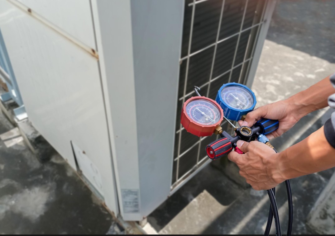 HVAC technician checking refrigerant leak in Coachella Valley home